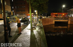 Hulpdiensten opgeroepen voor dronken man in gracht Veenkade Den Haag