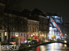 Containerbrand slaat over op pand: brandweer schaalt groot op Oost Indiëplaats Delft