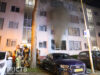 Brandweer schaalt op bij brand in portiekwoning Kuinrestraat Den Haag
