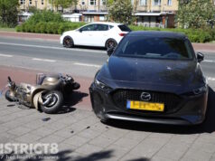 Scooterrijder gewond na botsing met onherkenbaar politievoertuig Soestdijksekade Den Haag