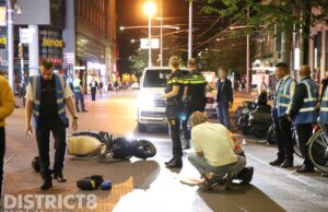 Pakketbezorger gewond na aanrijding met scooter Spui Den Haag