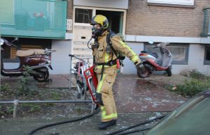 Twee aanhoudingen na kelderbrand in portiekflat Den Haag