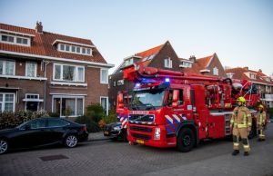 Schoorsteenbrand blijkt schittering van laagstaande zon Stadhouderslaan Schiedam