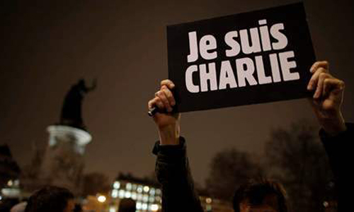 A man holds a placard which reads "I am Charlie" to pay tribute