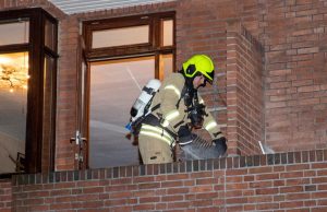 Brand in schoorsteen van woning Vlaardingerdijk Schiedam